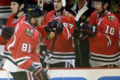 crawford, hossa dominate as chicago ousts wild